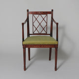 A late 19th/early 20th century Hepplewhite style open armchair with square back and painted floral decoration.