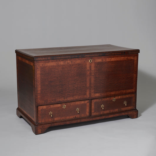 A 19th century oak coffer with two drawers to the base and cross-banding to the top, front and sides.