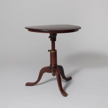 An unusual George III campaign table with round top, extending central support & tripod base, circa 1770.