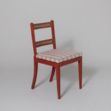 A pair of small Regency painted side chairs with two caned cross-rails to the backs and caned seats c.1810.