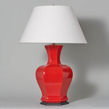 A mid-20th century red glazed porcelain hexagonal lamp.