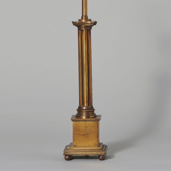 A small brass lamp with cluster-form column on a square base, probably 19th century, rewired.