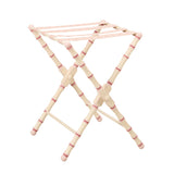 A HAND PAINTED TURNED WOODED LUGGAGE STAND (DESIGN DATING FROM THE 1940'S) FINISHED WITH A PATERAE BRAID.