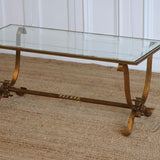 A 1940'S FRENCH GILDED IRON COFFEE TABLE WITH A GLASS TOP WITH MIRRORED BORDER IN THE STYLE OF GILBERT POILLERAT.