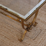 A 1940'S FRENCH GILDED IRON COFFEE TABLE WITH A GLASS TOP WITH MIRRORED BORDER IN THE STYLE OF GILBERT POILLERAT.