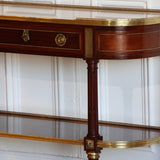 AN EARLY 20TH CENTURY FRENCH MAHOGANY CONSOLE DESSERT IN THE LOUIS XVI TASTE, RETAINING THE ORIGINAL MARBLE TOP AND GILT BRONZE MOUNTS.