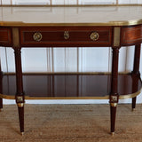 AN EARLY 20TH CENTURY FRENCH MAHOGANY CONSOLE DESSERT IN THE LOUIS XVI TASTE, RETAINING THE ORIGINAL MARBLE TOP AND GILT BRONZE MOUNTS.