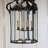 AN EARLY 20TH CENTURY ITALIAN PATINATED TOLE LANTERN OF LARGE SCALE, REWIRED.