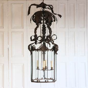 AN EARLY 20TH CENTURY ITALIAN PATINATED TOLE LANTERN OF LARGE SCALE, REWIRED.