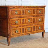 A LATE 18TH CENTURY FRENCH LOUIS XVI PERIOD WALNUT AND MARQUETRY COMMODE WITH INLAID DECORATION TO THE DRAWER FRONTS AND TO THE TOP.
