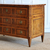 A LATE 18TH CENTURY FRENCH LOUIS XVI PERIOD WALNUT AND MARQUETRY COMMODE WITH INLAID DECORATION TO THE DRAWER FRONTS AND TO THE TOP.