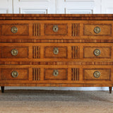 A LATE 18TH CENTURY FRENCH LOUIS XVI PERIOD WALNUT AND MARQUETRY COMMODE WITH INLAID DECORATION TO THE DRAWER FRONTS AND TO THE TOP.