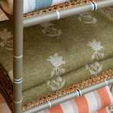 The 90th anniversary Berkeley Sprig lap rug woven in Scotland from 100% lambswool. Olive.