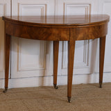 AN LATE 18TH CENTURY ENGLISH DEMI-LUNE FRUITWOOD TABLE WITH LOVELY COLOUR AND ORIGINAL BRASS CASTORS, OPENS UP TO MAKE A BREAKFAST TABLE.