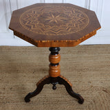 A LATE 19TH / EARLY 20TH ITALIAN OCCASIONAL TABLE WITH OVERALL GEOMETRIC DECORATION IN A VARIETY OF WOODS.