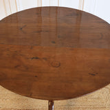 A MID 18TH CENTURY ENGLISH PROVINCIAL YEW WOOD TRIPOD TABLE.