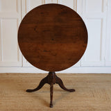 A MID 18TH CENTURY ENGLISH PROVINCIAL YEW WOOD TRIPOD TABLE.