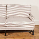 The Falconer sofa with a polished or ebonised underframe. Made to order in the fabric of your choice.