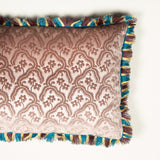 A Cushion made up in a dusky mauve gaufragged velvet with a cut fringe to the edge, backed in blue silk. £410 each + vat.