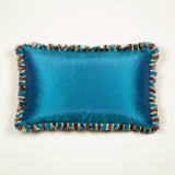 A Cushion made up in a dusky mauve gaufragged velvet with a cut fringe to the edge, backed in blue silk. £410 each + vat.