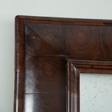A rectangular oyster-veneered cushion-frame mirror, early 18th century style but probably 19th century.