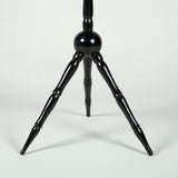 A late 19th century French round table with an ebonised finish on a tripod base.