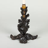 An unusual candlestick lamp with a cast-iron base in the form of scrolling acanthus leaves, 19th century