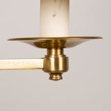 An articulated brass wall light with round back plate. Late 20th century, rewired.