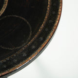 A late 19th century French round table with an ebonised finish on a tripod base.
