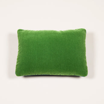 A rectangular cushion faced with green mohair velvet backed in blue wool. £272 inc vat.