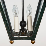 A mid-century French gilt iron lantern of tapered squared shape, the upper structure in the form of swags of fabric. Possibly by Poillerat, circa 1950.