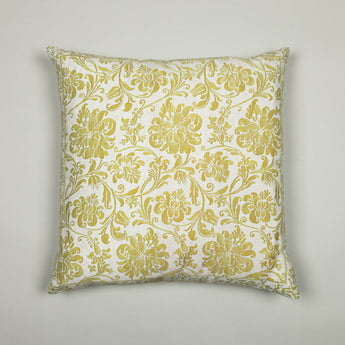 A 18” square cushion made up in a pale green patterned fabric.