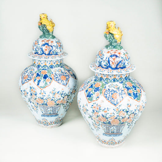 A pair of important Delft Cashmere palette vases and covers, circa 1700-20, bearing the iron-red PAK mark for Pieter Adriaensz Kocx, one of the most celebrated early Delftware potters and artists. With restorations.