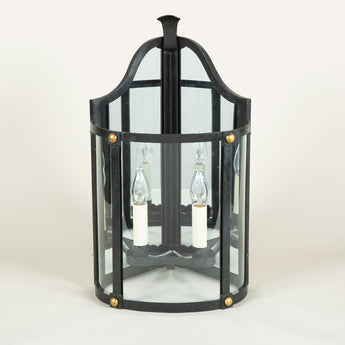 A pair of wrought iron corner wall lanterns in a black painted finish with gilt details. £3,400.00 each