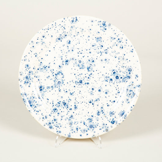 Plates decorated with a splattered blue pattern on a cream ground. £84 inc vat each.
