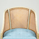 A late 18th century painted beech tub chair with caned back, arms and seat. Neoclassical decoration later.