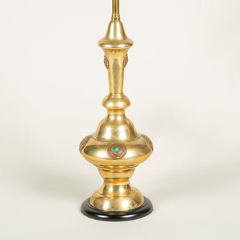 A turned brass Islamic vase decorated with turquoise cabochons, wired as a lamp.
