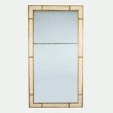 An early 19th century mirror with a divided mercury plate and a redecorated parcel gilt and white painted frame.