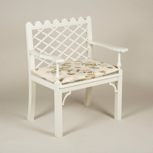 A lattice back garden armchair with shaped arms and crenellated top. Based on an old Colefax and Fowler design from the 1950’s. Made to order. Bespoke size and colour available upon request.