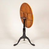 A late 18th early 19th century Swedish tripod table with a segmentally veneerd Masur birchwood top and ebonised base.