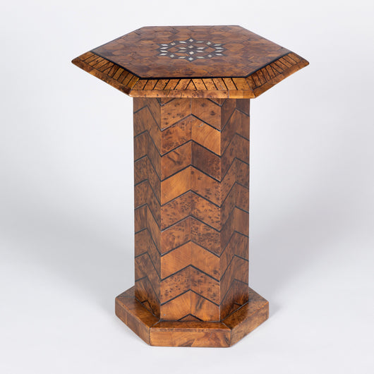 A near pair of low hexagonal tables veneered with wood and mother of pearl in an Islamic/Art Deco manner.