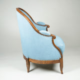 A charming Louis XVI elm-framed bergere with narrow arched back. French provincial, circa 1780.