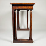 An early 19th century mahogany console/serving table with simple column supports and good colour and patination.