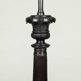 A pair of bronze column lamps with campagna capitals and claw feet. Not antique.