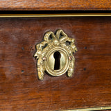 A brass mounted mahogany bureau in simple Louis XVI style. French, mid-20th century.