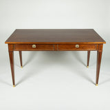 A brass mounted mahogany bureau in simple Louis XVI style. French, mid-20th century.