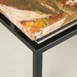 A Sicilian jasper veneered table top mounted on a metal base as a coffee table.