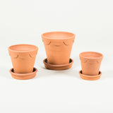 A terracotta flower pot with a scallop decorated rim with saucer - Small size.