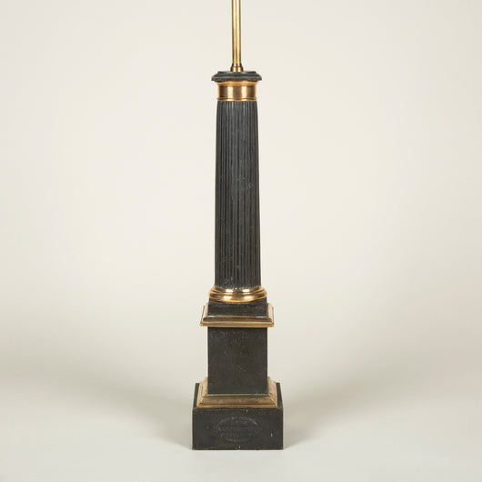 An early 19th century French black tole and brass column lamp of good size, the fluted column on a square plinth base. Circa 1830, original paint. Rewired.