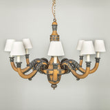 A carved and painted wooded eight arm chandelier, French Empire period. Circa 1810, wired for electricity.